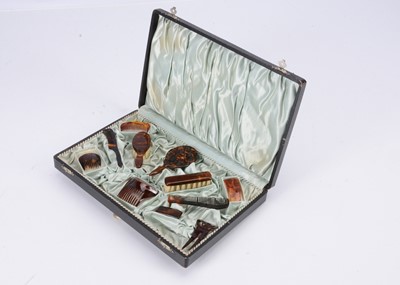 Lot 784 - A late 19th century boxed set of doll’s tortoiseshell hair accessories