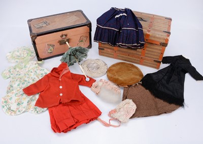 Lot 793 - Two canvas covered cross-banded wooden doll’s trunks and contents