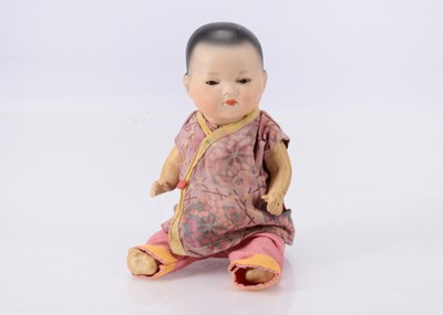 Lot 818 - A small Armand Marseille Ellar Asian baby doll