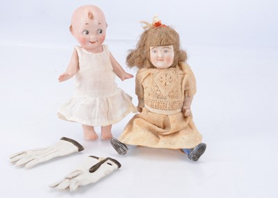 Lot 825 - A small German all-bisque comic googlie eyed doll
