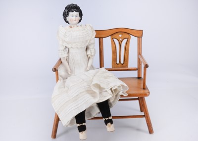 Lot 826 - An 19th century pink tint china shoulder-head doll