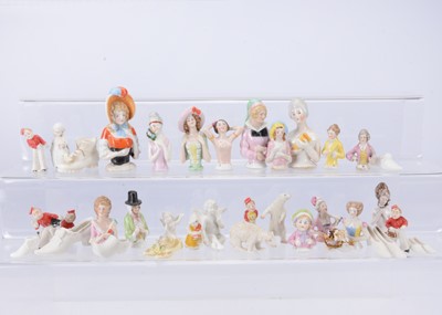 Lot 863 - A selection of half doll/pin cushions and cake decorations