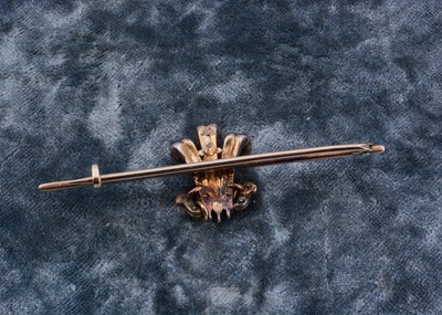 Lot 1 - An early 20th Century diamond set Prince of Wales bar brooch