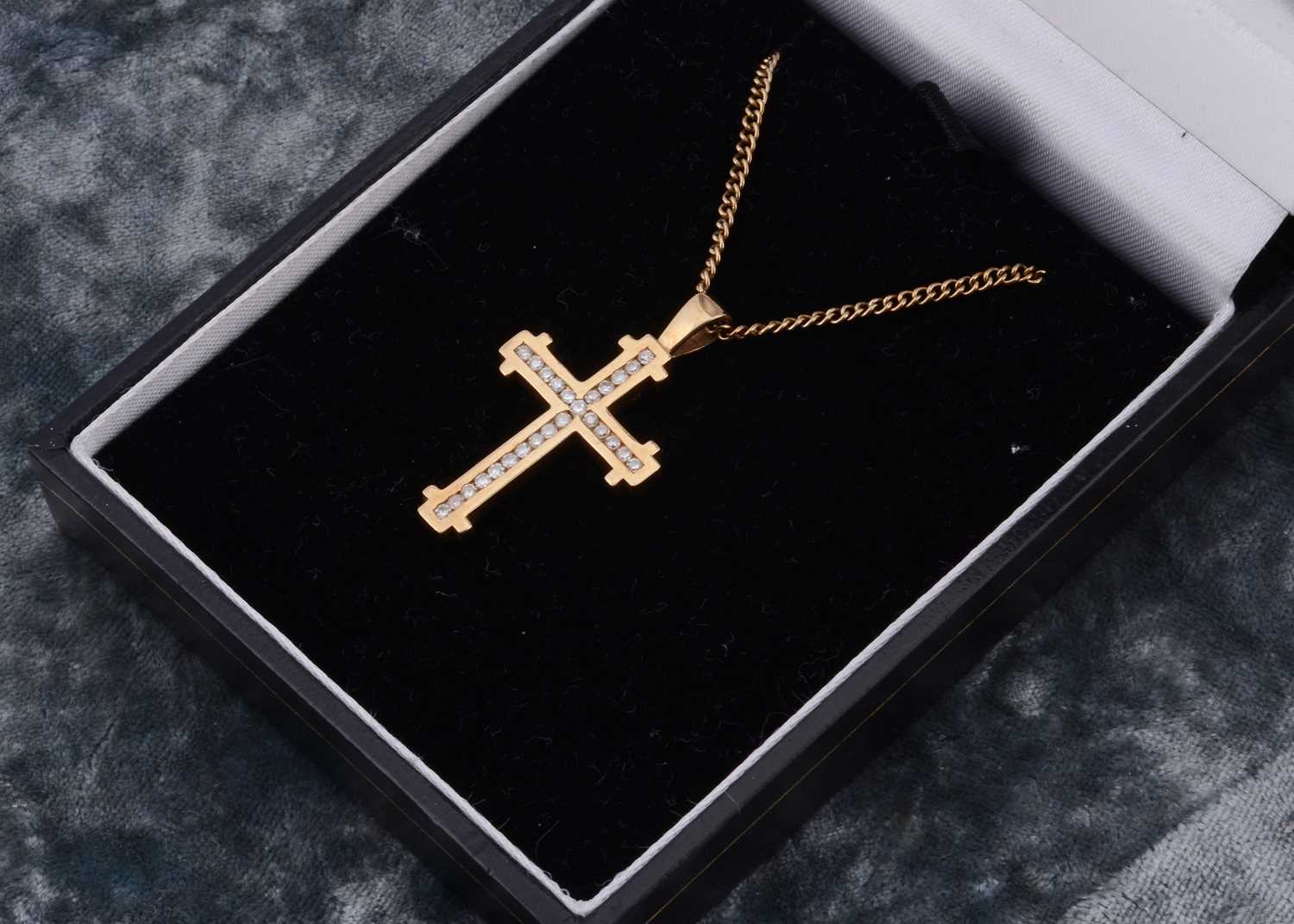 Lot 6 - A 9ct gold diamond set celebration cross