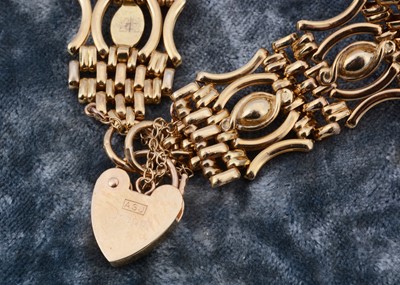 Lot 7 - A 9ct gold celebration gate bracelet