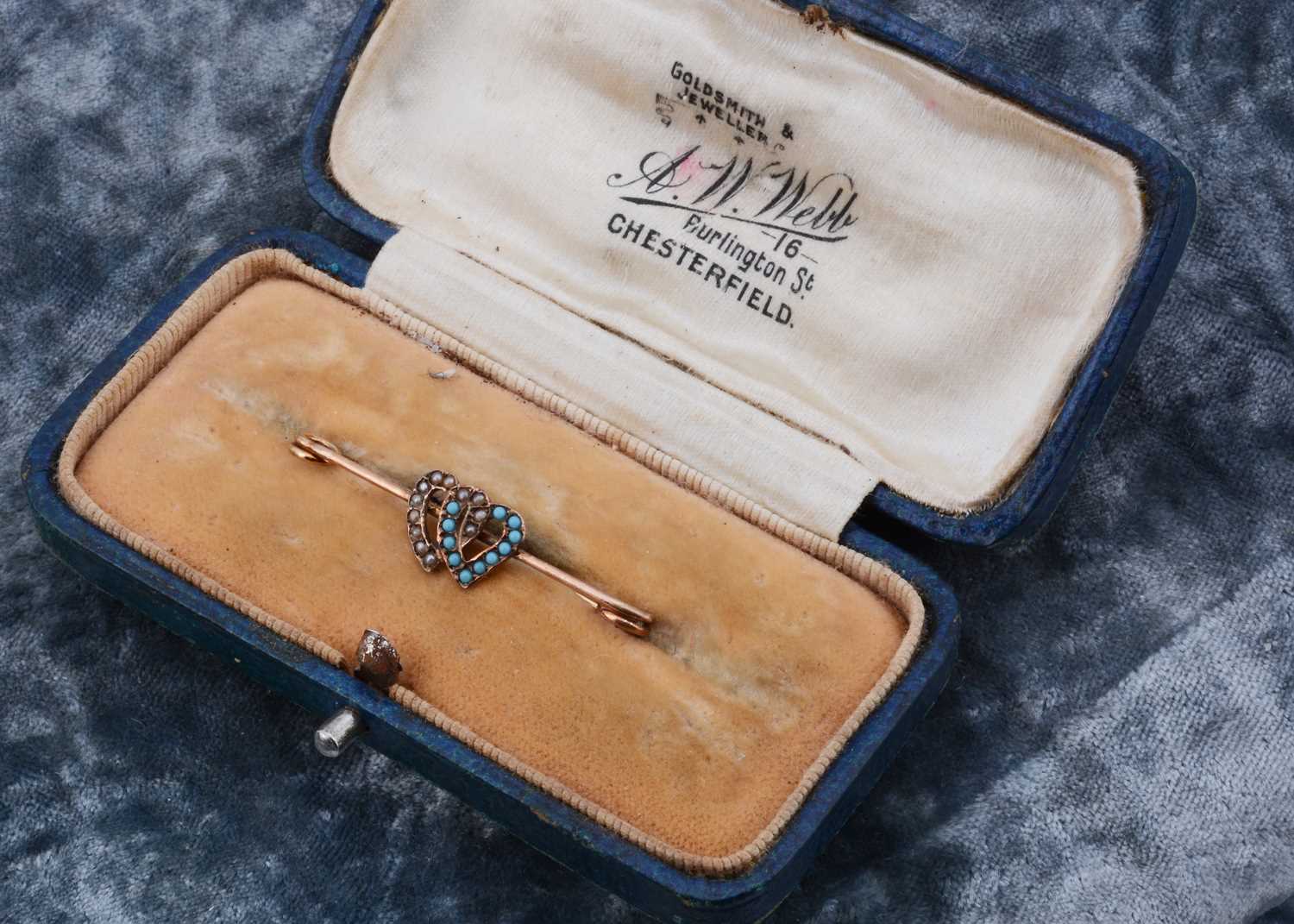 Lot 10 - An Edwardian double heart gold safety pin brooch