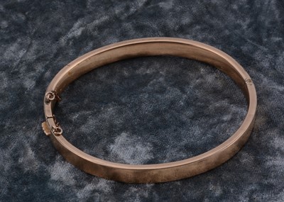 Lot 18 - A 9ct gold oval bangle