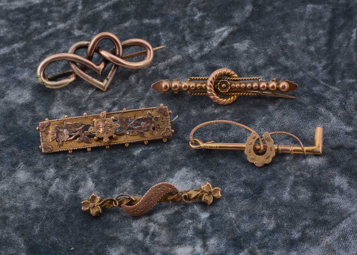 Lot 19 - Five gold bar brooches