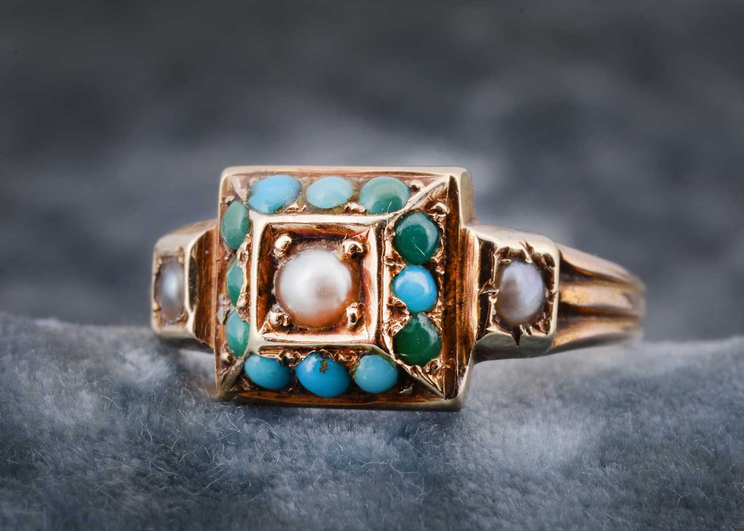 Lot 34 - A 15ct gold seed pearl and turquoise dress ring