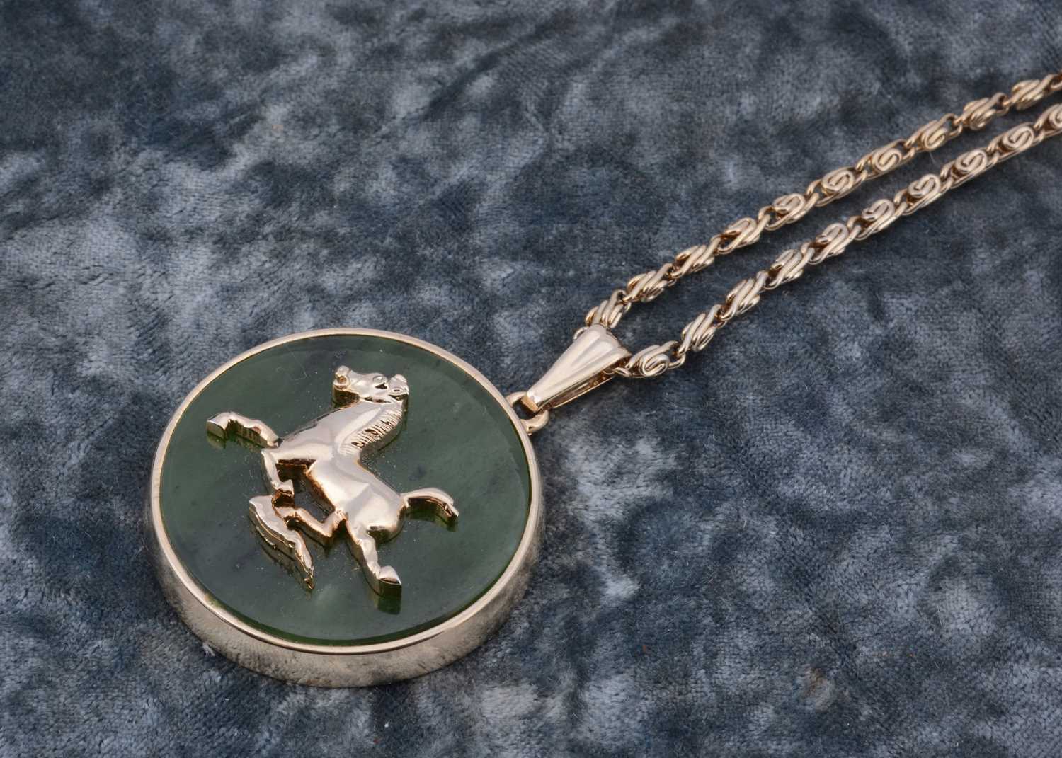 Lot 43 - A jadeite jade flying horse pendant