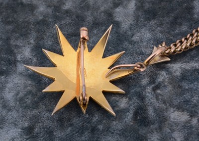 Lot 52 - An Edwardian 9ct gold seed pearl star drop pendant and brooch