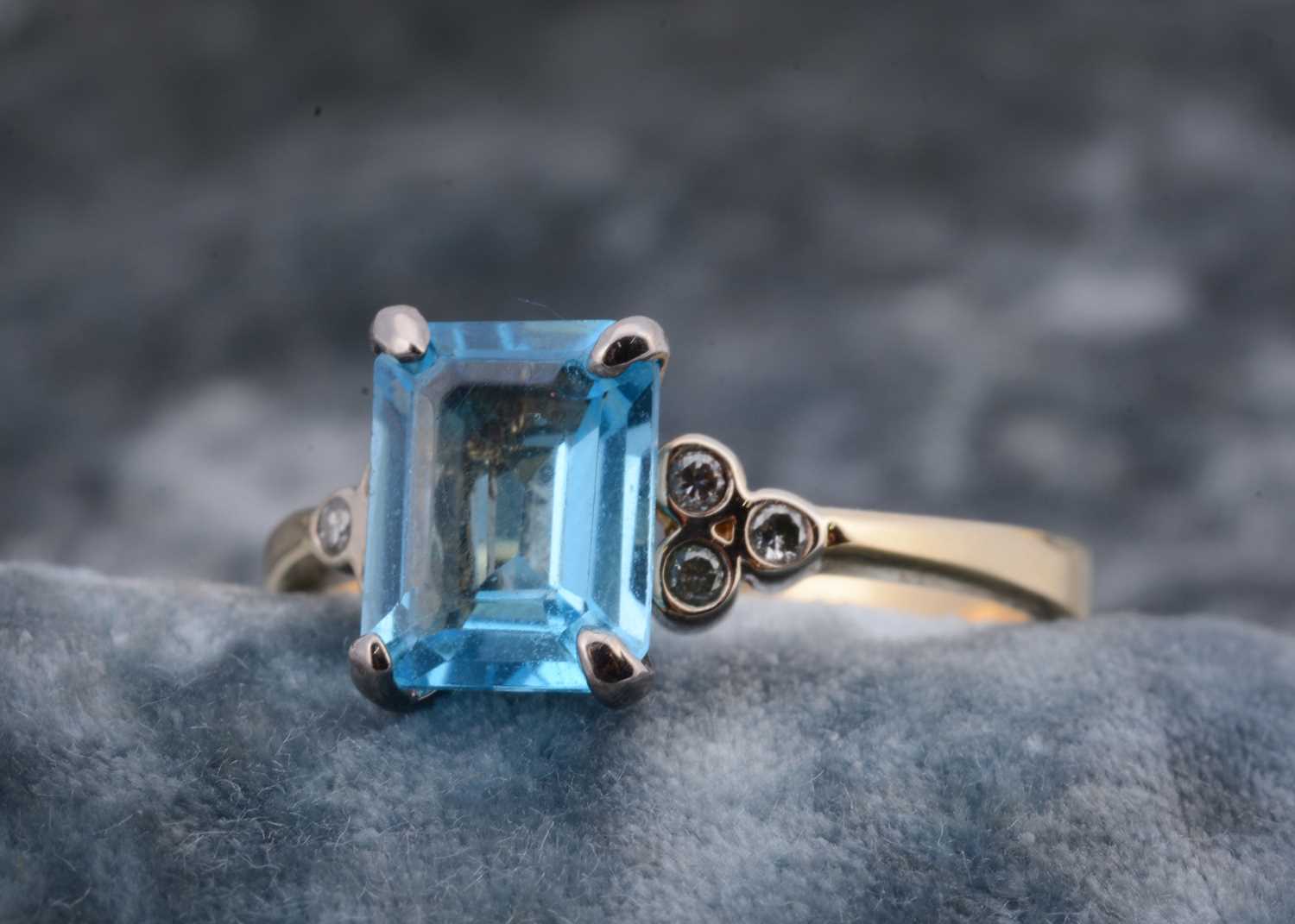 Lot 55 - An 18ct gold continental topaz and diamond dress ring