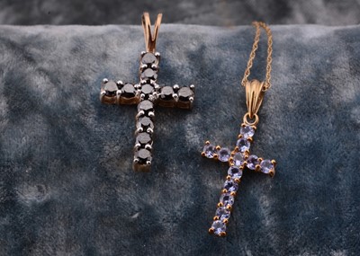 Lot 56 - A 9ct gold tanzanite set cross pendant and chain