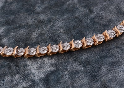 Lot 60 - A 9ct gold diamond set line bracelet