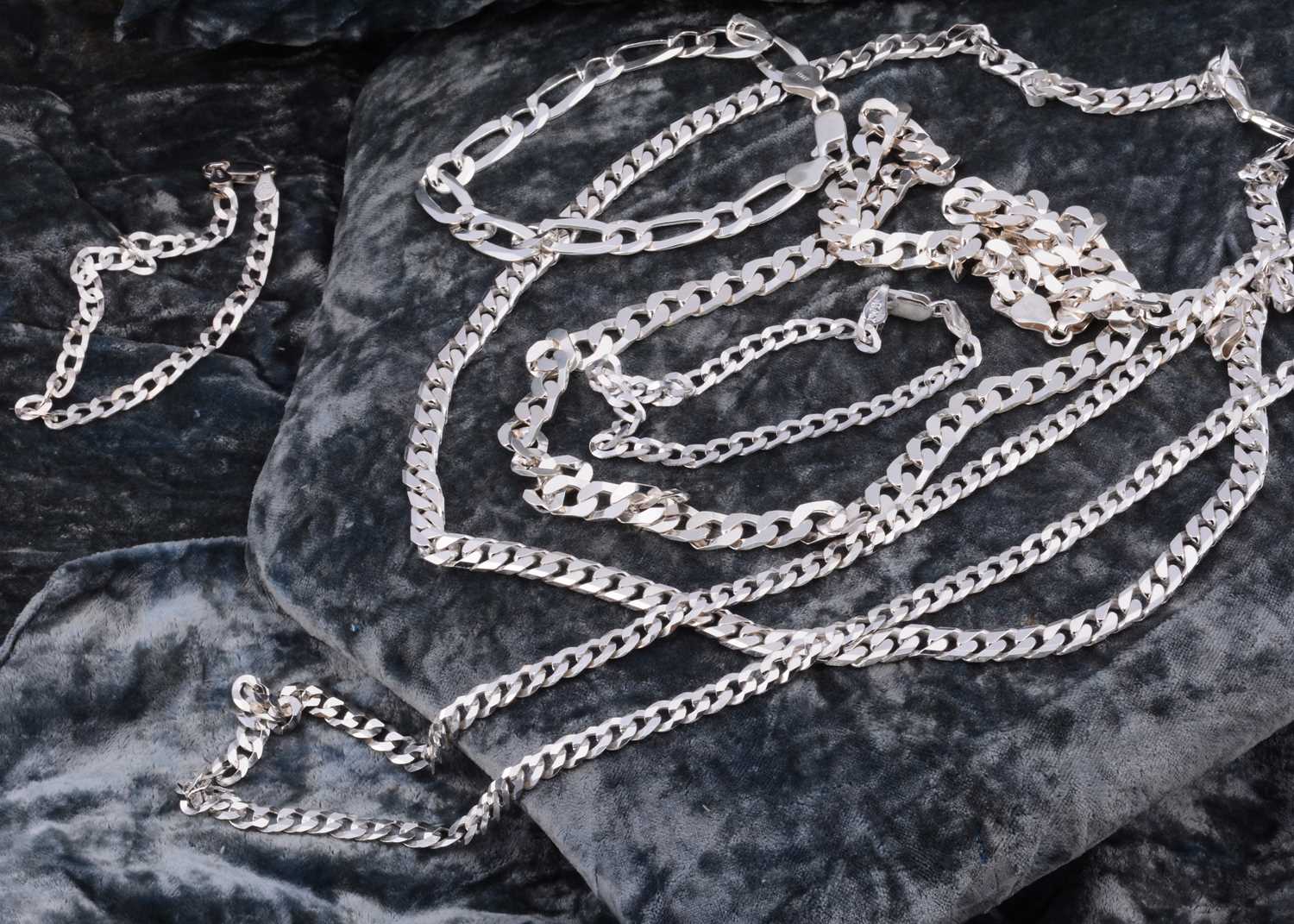 Lot 61 - A collection of silver flattened curb link chains