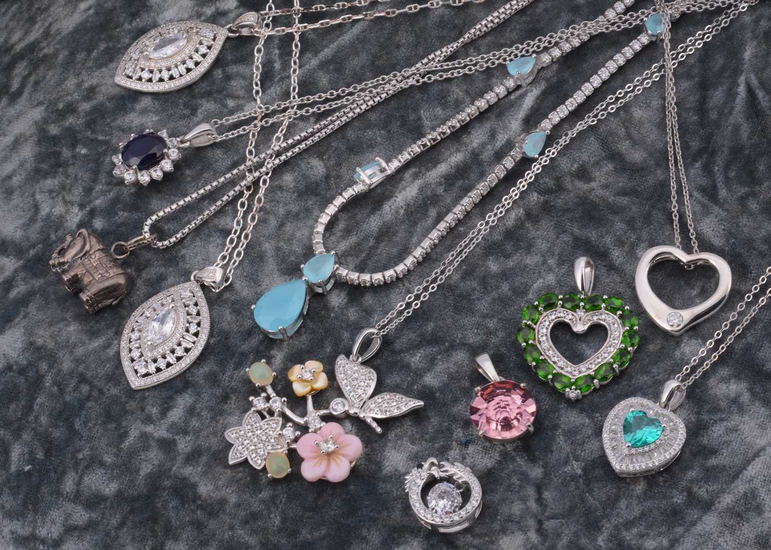 Lot 63 - A collection of gem set silver pendants