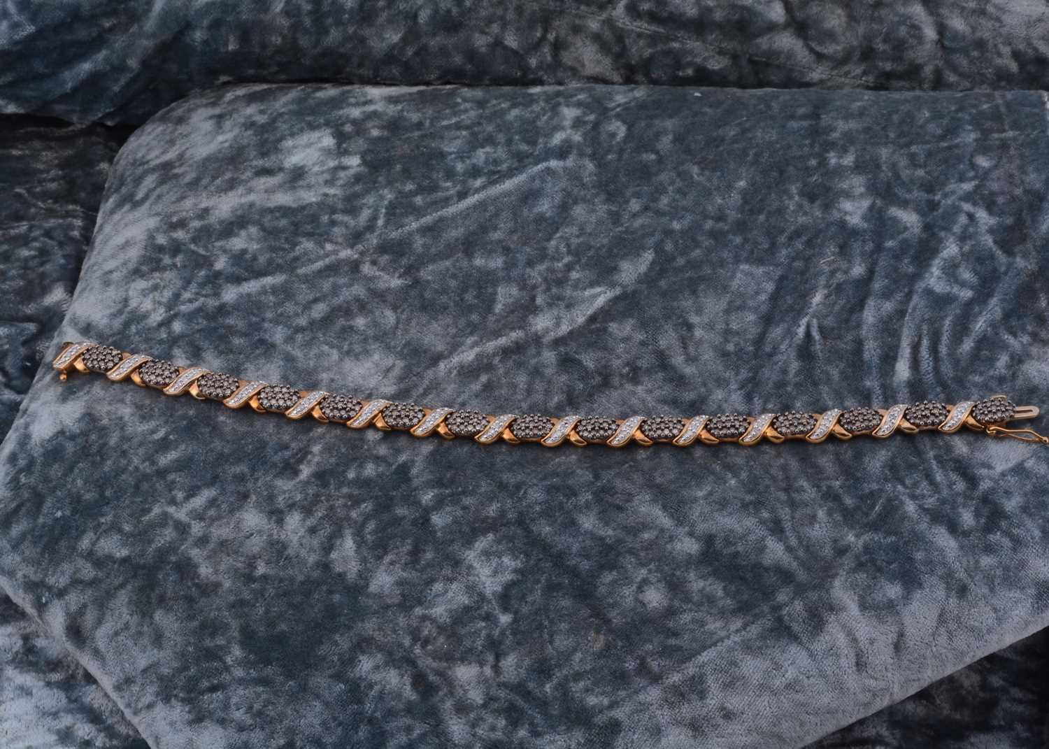 Lot 69 - A 9ct gold diamond set bracelet