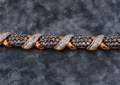 Lot 69 - A 9ct gold diamond set bracelet