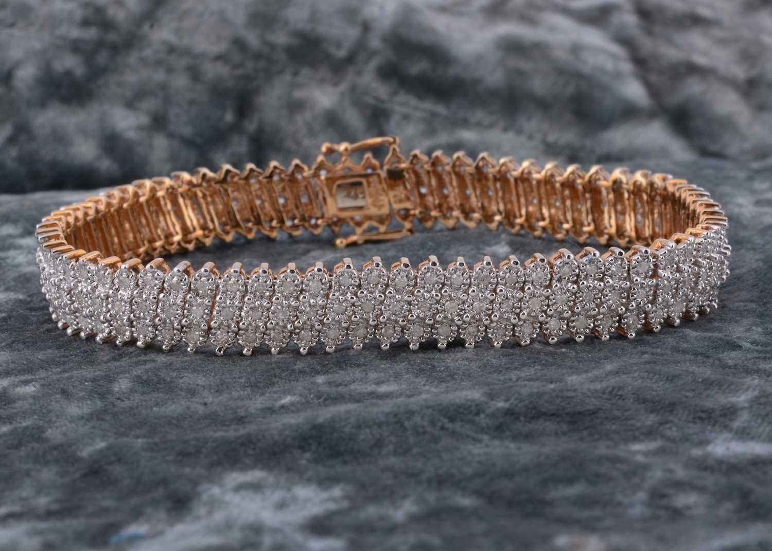 Lot 70 - A 9ct gold flattened diamond set bracelet