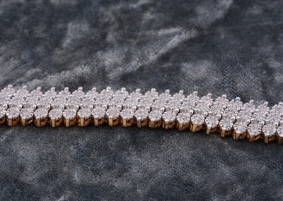 Lot 70 - A 9ct gold flattened diamond set bracelet