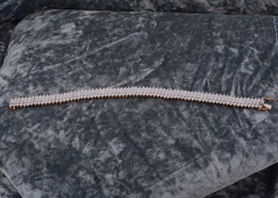 Lot 70 - A 9ct gold flattened diamond set bracelet