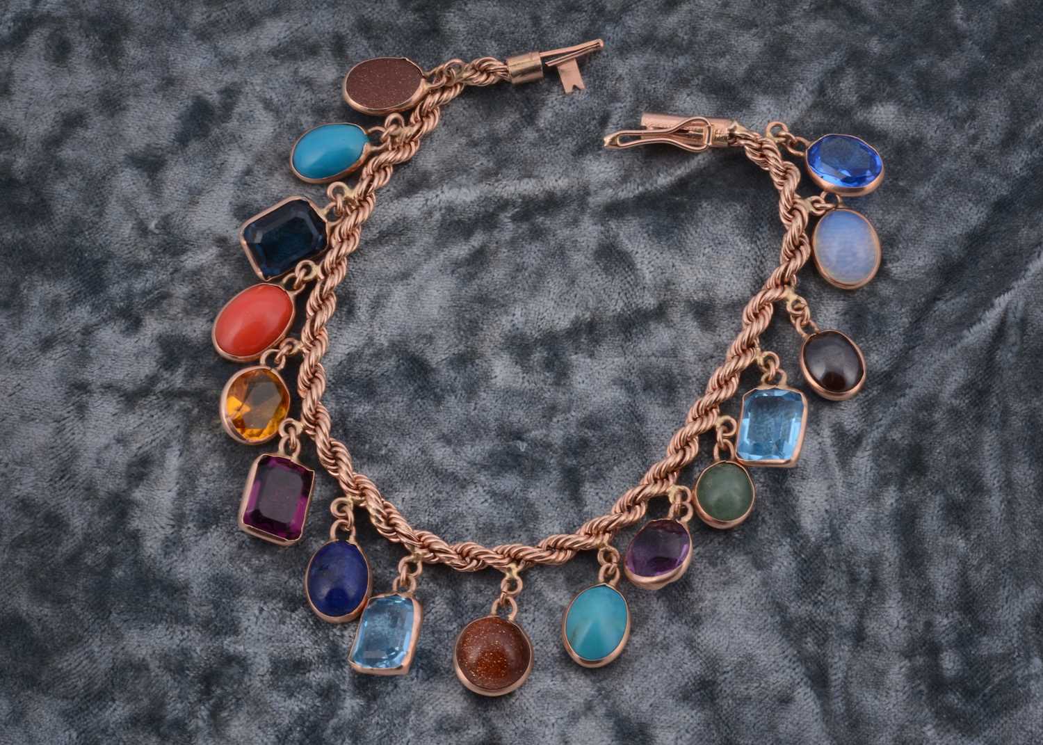 Lot 73 - A multi gem set 9ct gold bracelet