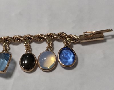 Lot 73 - A multi gem set 9ct gold bracelet