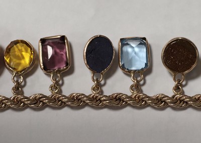 Lot 73 - A multi gem set 9ct gold bracelet
