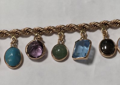 Lot 73 - A multi gem set 9ct gold bracelet