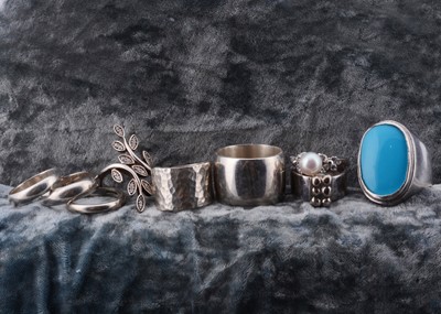 Lot 102 - A collection of gem set and plain silver rings