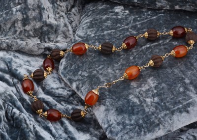 Lot 106 - An early 20th Century amber and bead necklace