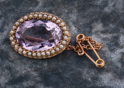 Lot 120 - A Victorian amethyst and seed pearl oval brooch