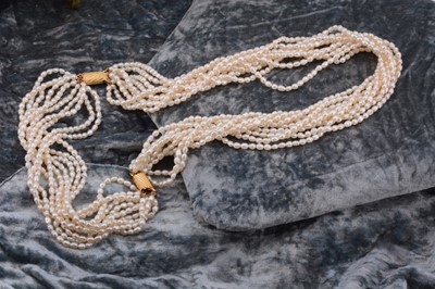 Lot 125 - A freshwater multi strand pearl necklace and bracelet