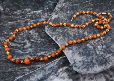 Lot 130 - A 19th Century amber and gold filigree sphere necklace