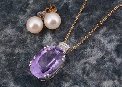 Lot 131 - An amethyst and diamond pendant and chain
