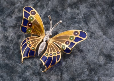Lot 134 - A continental 18ct gold diamond and enamel plique a jour butterfly brooch