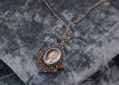 Lot 143 - An Austro Hungarian filigree framed renaissance style portrait miniature pendant drop