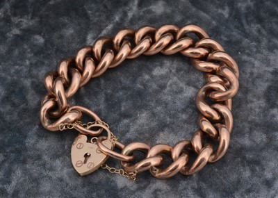 Lot 207 - A yellow metal curblinked padlock clasp bracelet