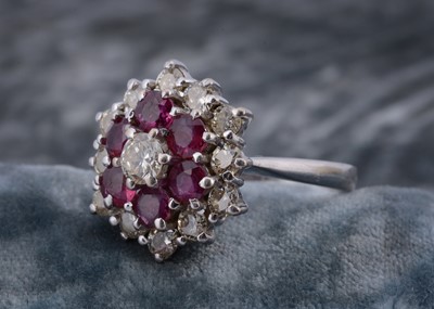 Lot 223 - An 18ct white gold ruby and diamond cluster ring