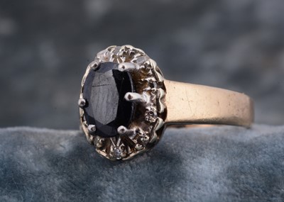 Lot 228 - A 9ct gold sapphire and diamond cluster ring