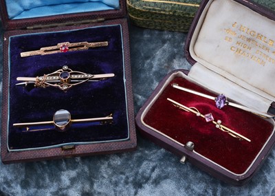 Lot 260 - Five Edwardian gem set stick pins