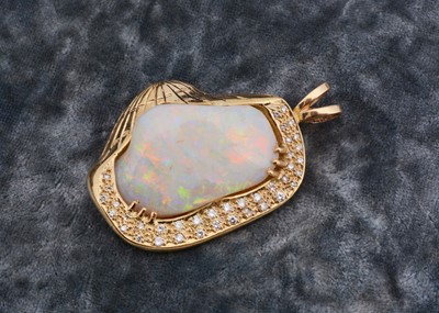 Lot 277 - A precious opal and 18ct gold and diamond set shell pendant