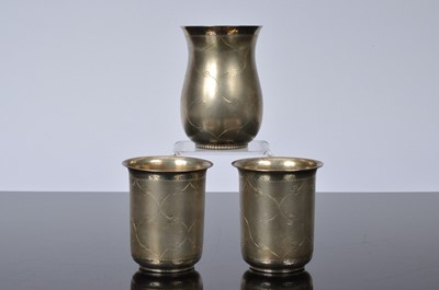 Lot 294 - Three mid 20th century Indian silver beakers