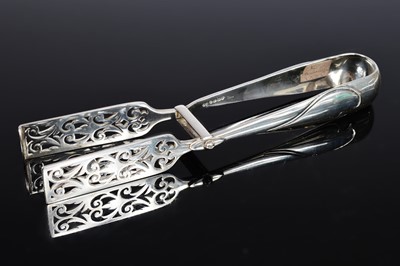Lot 345 - A pair of Victorian silver asparagus servers by Frederick Elkington