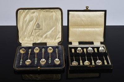 Lot 357 - Two sets of six silver and enamelled coffee spoons by Turner & Simpson
