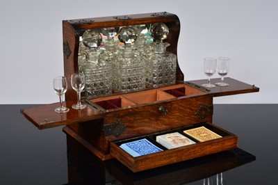 Lot 499 - A Victorian oak tantalus games compendium