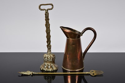 Lot 500 - A Regency period brass doorstop