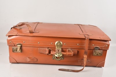 Lot 52 - A large brown leather travel trunk/suitcase