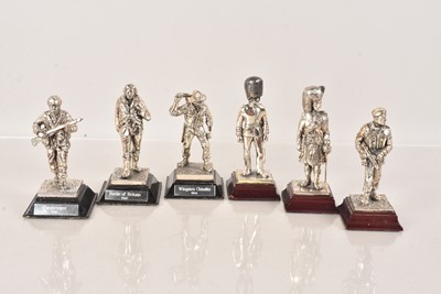 Lot 585 - A group of six white metal figures of soldiers