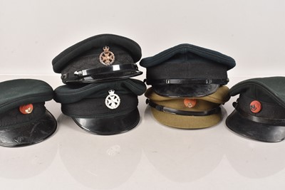 Lot 639 - A collection of Military Peak Caps